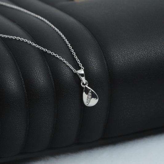 DROP PEAR PENDANT WITH EMBEDDED ZIRCONIA STONES - STERLING SILVER