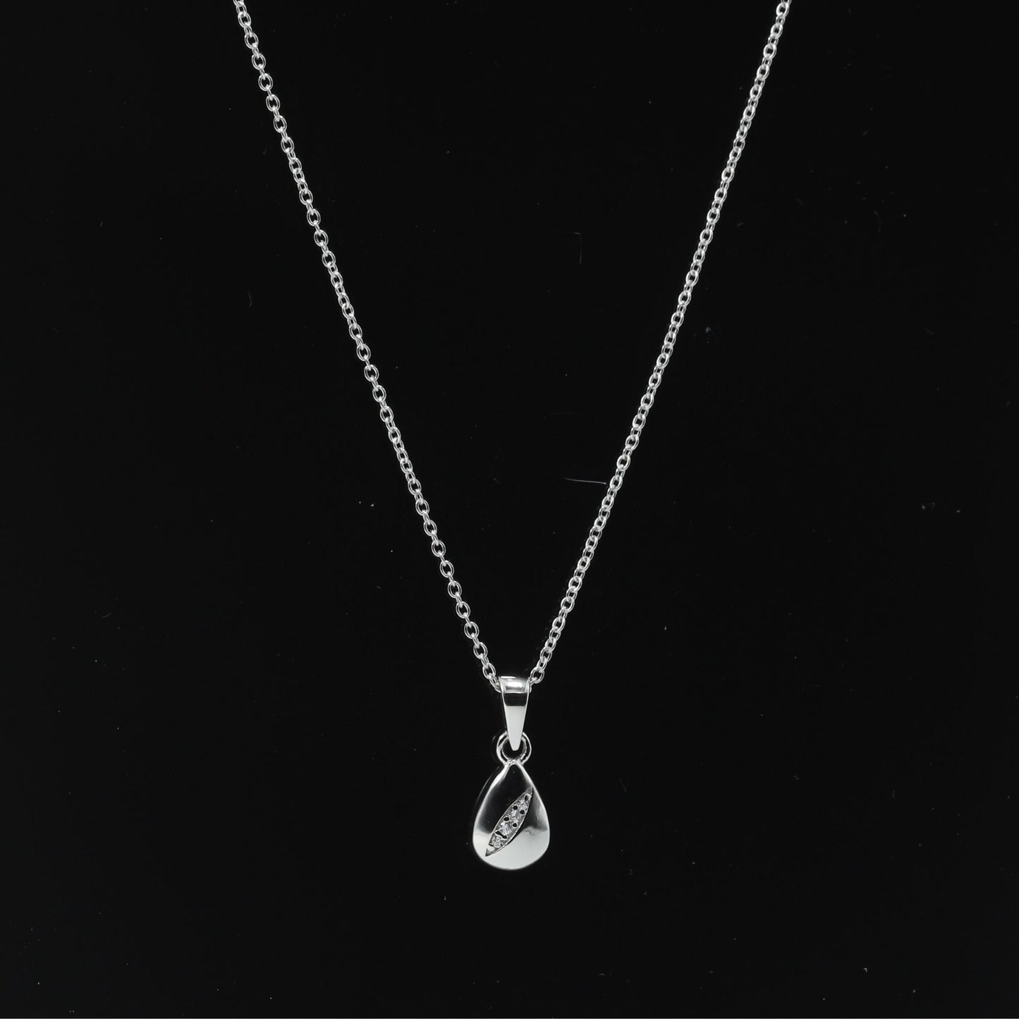 DROP PEAR PENDANT WITH EMBEDDED ZIRCONIA STONES - STERLING SILVER